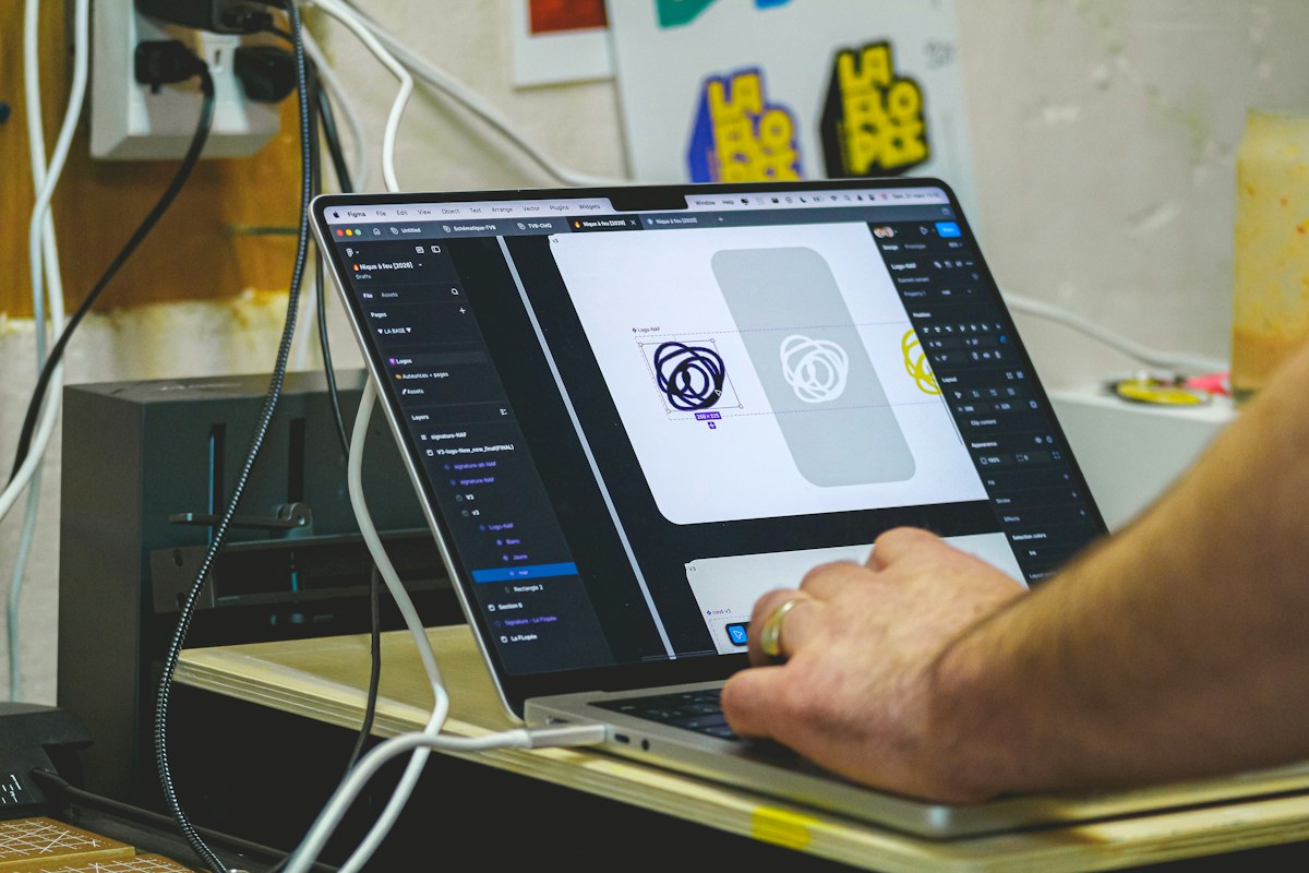 Designer working on a brand identity in a digital design tool